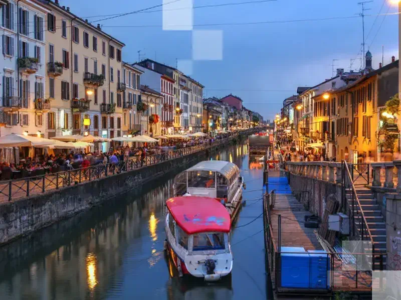 Evening scene along the Naviglio Grande canal in Milan, Italy.