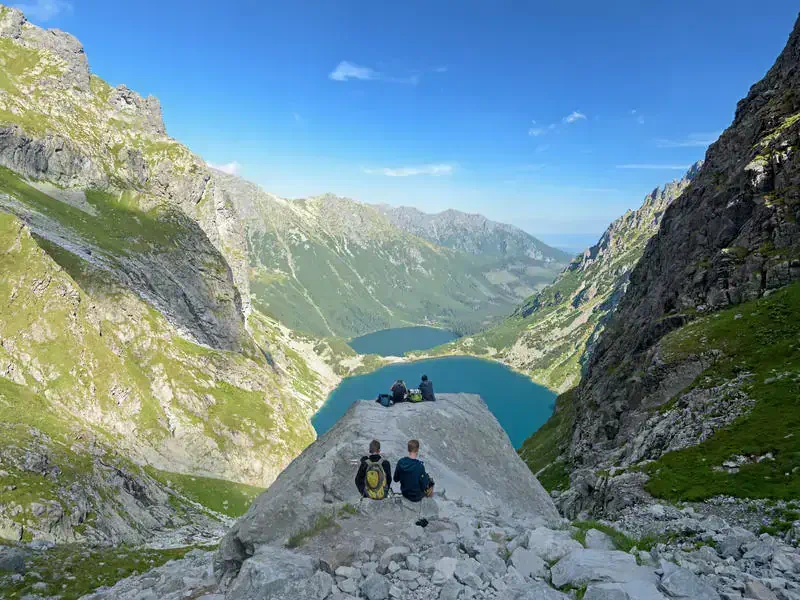 Zakopane, Poland - Aug 13, 2018: Hikers ejoy the view of the of Czarny Staw pod Rysami and Morskie Oko lakes in the High Tatra Mountains.; Shutterstock ID 1159359775
